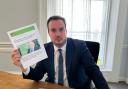 East Devon MP Simon Jupp pictured with the EDDC press release referring to the letter sent to lobby for swimming pool funding, which the council never applied for.