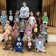Naomi Garrick in her Dalmatian costume with children from Hazel Class