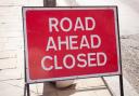 Sign indication that road ahead is closed on the street