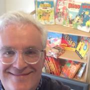 Beano fan Vincent Hicks with some of his vintage comics