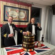 Lt.-Cdr. Martyn Mayger and PO Dave Morris of TS Saumarez with a tot from the rum tub of the famous WWII destroyer HMS Saumarez