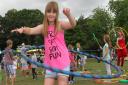 Seven year old Freya Wright from Exmouth shows off her hoop skills at the Family Day in Phear Park. Ref exe 31-16SH 4163. Picture: Simon Horn.
