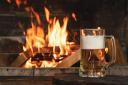 Not much beats a pint in front of a pub's open fire in winter