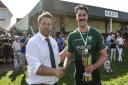 Sidmouth captain Ollie Pyne receiving the Devon Intermediate Cup from Glenn Channing, representing the Devon RFU after Sidmouth's win over Crediton in the final played at the Blackmore. Picture PPAUK