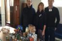The Sid Valley Food Bank's Andie Milne with Tom De Remer and Tom Lovatt