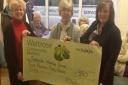 Sidmouth Voluntary Services recieves £550 donation from Waitrose Community Matters

Pictured from the left:  Hazel Apps, Kay Drodge, Tony Drodge, Francis Newth and Julie Marish (with dining club members in the background)