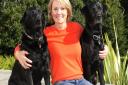 Clare Harvey pictured with her dogs Todd and Mack was delighted that a letter she dropped in the Byes was sent onto her sister in Canada, the person who picked up the letter paid for the postage before it was sent as Clare was on her way to the Post Offic