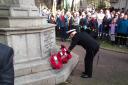 Lieutenant-Commander (Rtd) Chris Pink lays a wreath on behalf of Sidmouth Royal Naval Old Comrades Association