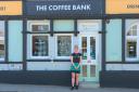 Louise Jones outside the repainted Coffee Bank, complete with pictures of bees at children's eye level