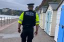 A police officer on high-visibility patrol in Seaton