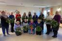 The flower arrangers with their creations