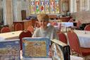 Sue Jeacock, parish administrator, with some of the jigsaw puzzles