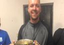 Billy Rouse with the Morrison Bell Cup in the dressing room at Ottery St Mary after his sides 2019 final success against Sidmouth Town. Picture: BR