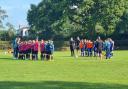 Young footballers paying their respects