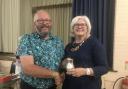 Roger Cozens receiving the Challenge Tankard Cup from Lady Cave