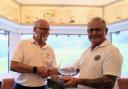 Reg (right) handing the bowl to winning Sidmouth's captain, Hugh Dorliac