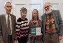 Cllr Rosemary Walker accepting the award with Climate Change Group volunteers Gill Cameron Webb, Ted Swan and Chris Lea.