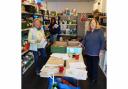 volunteers Jane, Ness and Kill in the Food Bank