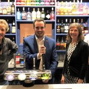 Harry Tucker, Simon Jupp MP, Andrea Tucker and Michael Dance behind the bar of the Exmouth Hotel