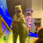 A man dressed as a dinosaur entertained crowds. Credit Julie Reid.