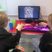 One the children playing Pacman. Credit Ottery St Mary Town Council.