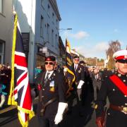 The Queen's Colours leading last year's Remembrance Sunday parade