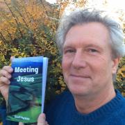 First-time author Geoff Purkiss with his book