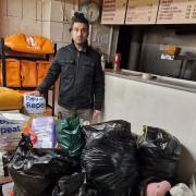 Omer Akbulut of the Charcoal Grill Kebab Shop with donations from Ottery residents
