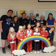 Frances Hallett, second on the left, with husband Ben; unit helper Stephanie Darby, Division Commissioner Helen Kingdon, District Commissioner Grace Essex, volunteer Emily, and Rainbows