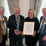 Last year's award: Town council chair Cllr Chris Lockyear, Ron Loynd, Teresa Loynd and Sidmouth Rotary president Bob Underhill