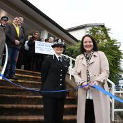 Cutting the ribbon at the reopening of Newton Abbot's police station enquiry desk