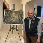 Painter James Tatum with his demonstration work