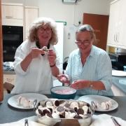 Annie & Sue preparing dessert