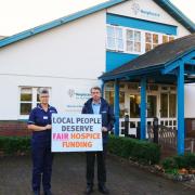 Hospiscare CEO and nurse with campaign banner