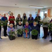 The flower arrangers with their creations