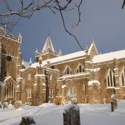 Ottery St Mary Church covered in snow