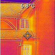 Infra-red camera image showing heat loss from a house