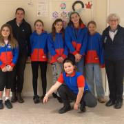 Guide leader Emily Francis and district commissioner Grace Essex with some of Sidmouth's Guides