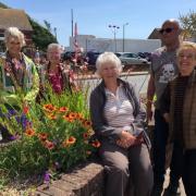 Sidmouth in Bloom volunteers taking a break at the Ham car park border
