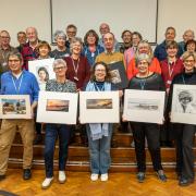 Members of Sidmouth Photographic Club with some of their work