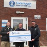 George Housden, Commercial Director, Sidmouth RFC, Alasdair Cameron, CEO, Sidmouth Hospice at Home (centre) and Matthew Barrett, Chair, Sidmouth RFC, at SHaH Sidbury HQ