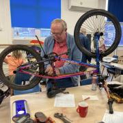 Fixing a bike at Sidmouth Repair Cafe