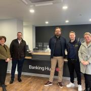 Simon Jupp MP with some of the banking hub's staff