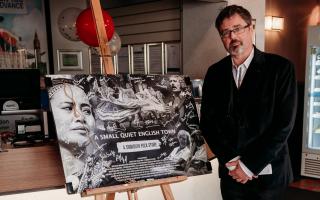 Producer Paul Tully with film poster at last August's premiere