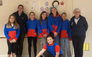 Guide leader Emily Francis and district commissioner Grace Essex with some of Sidmouth's Guides